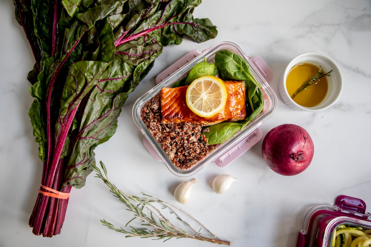 Fresh vegetables and healthy ingredients on a wooden kitchen counter
